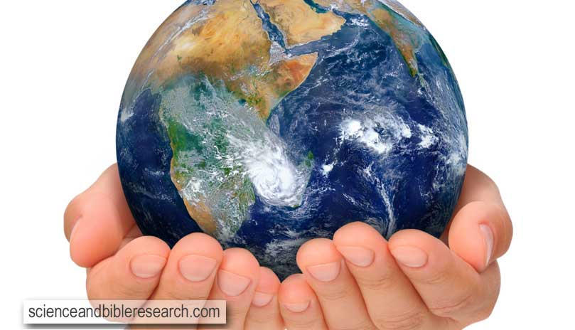 Hands holding globe, Africa and Near East. Isolated on white background. Earth image courtesy of NASA (Photo by brozova)